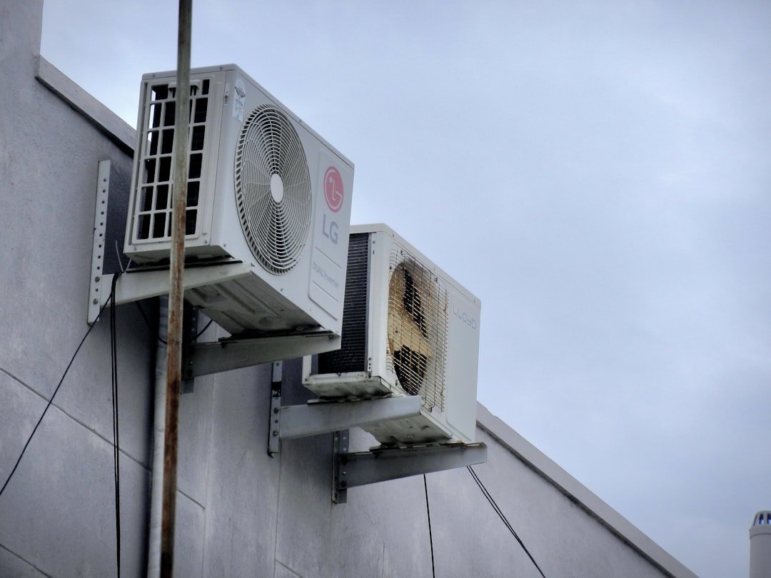 Air conditioning unit mounted on a building wall